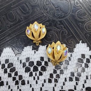 Kramer gold tone and rhinestone lotus earrings.